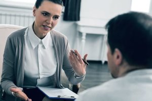 Female therapist leading a session at our adult counseling clinic in Houston