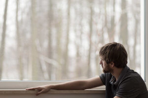 Troubled man wondering when his next anxiety attack will be