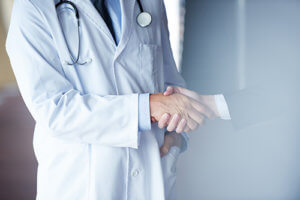 A handshake represents that Dr. G.K. Ravichandran psychiatrist Houston patients can now go to PACE Mental Health Houston