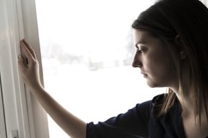 a woman experiences the winter blues or winter depression