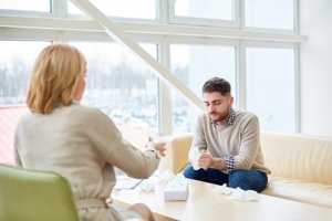 a man meets with a Houston mens mental health therapy psychiatrist