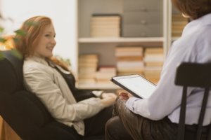 a woman meets with a Houston womens mental health therapy psychiatrist