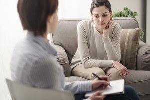 a woman talks to a psychiatrist at a Subutex treatment clinic